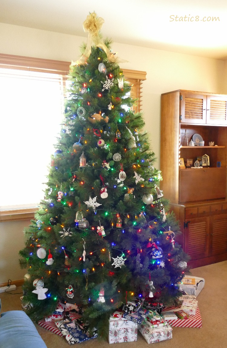 Decorated Christmas tree with wrapped gifts underneath