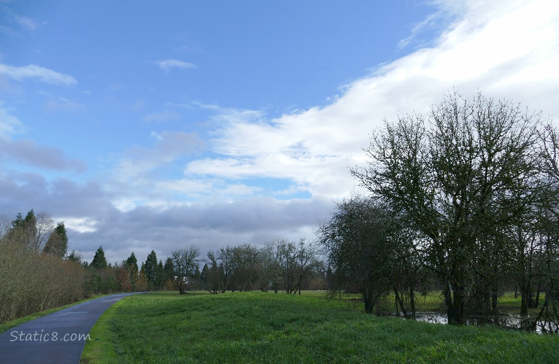 Clouds and blue sky above the bike path