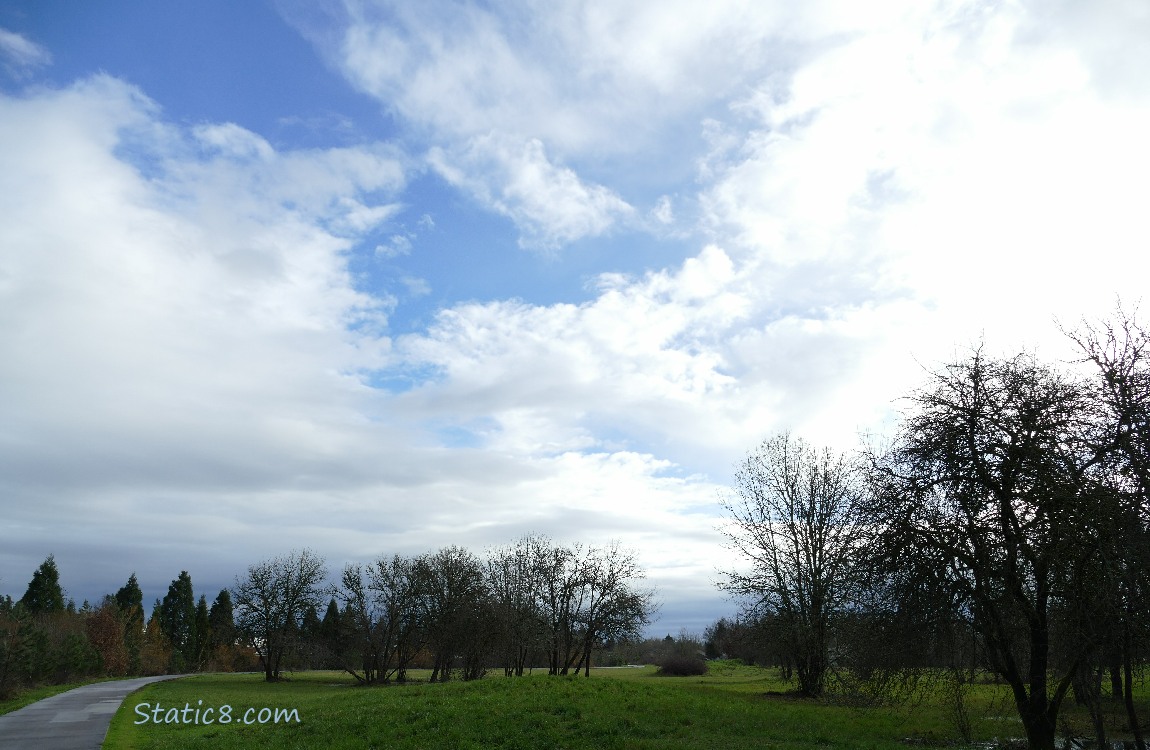 Blue sky and clouds over the bike path