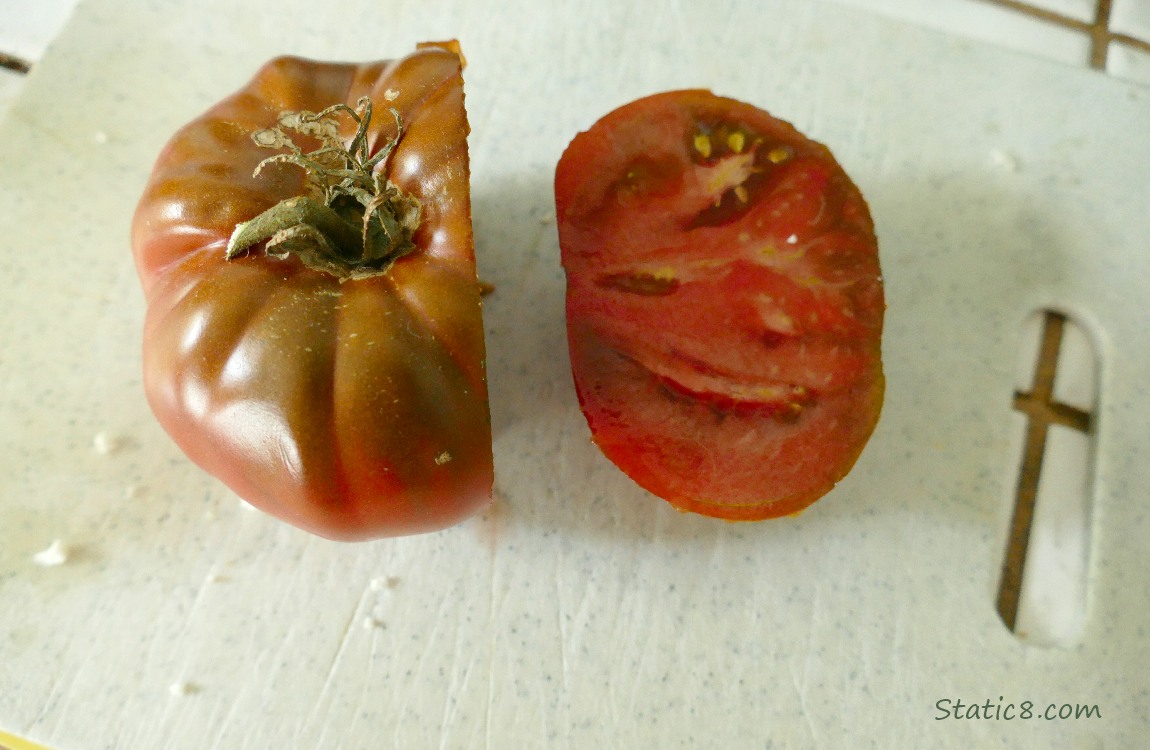 Tomato sliced on a cutting board