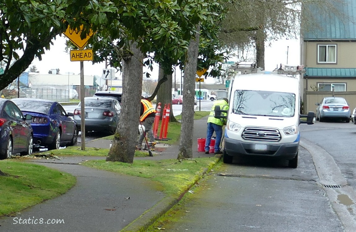 Workers on a city sidewalk
