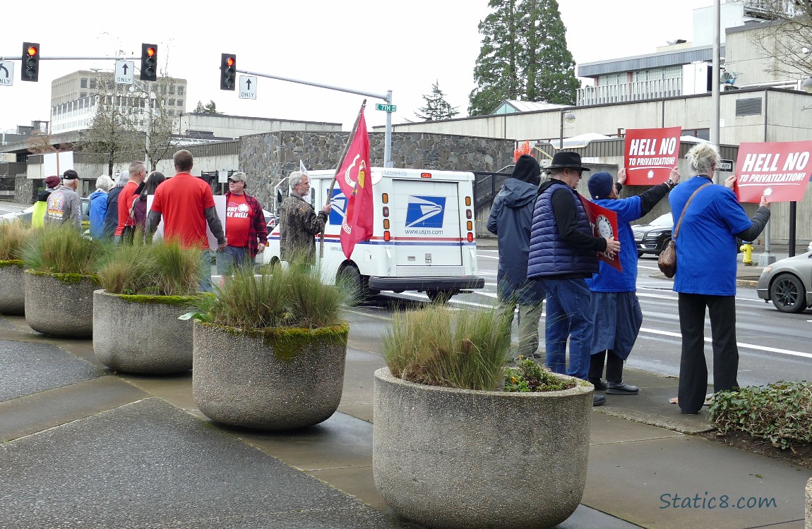 Protesters along a city street corner