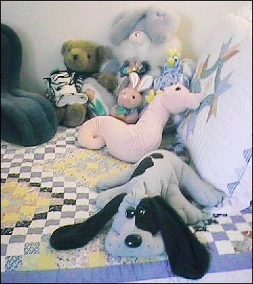 stuffed animals on bed