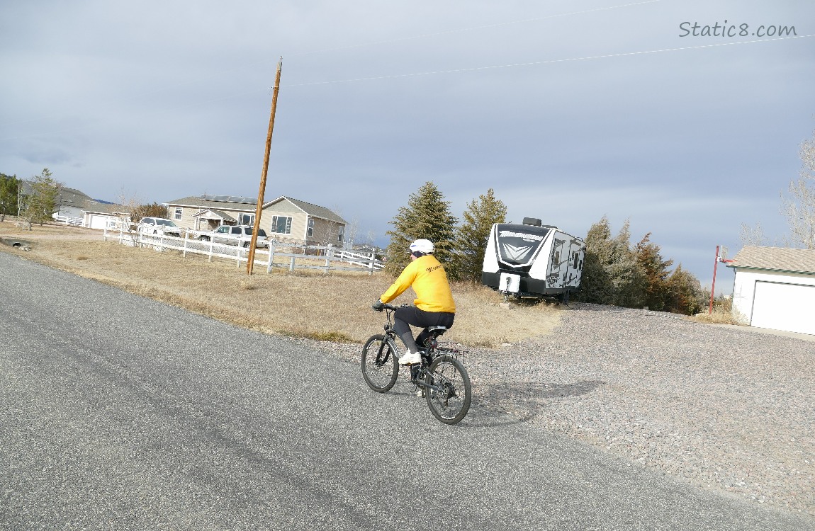 A person riding a bike in a Colorado neighborhood