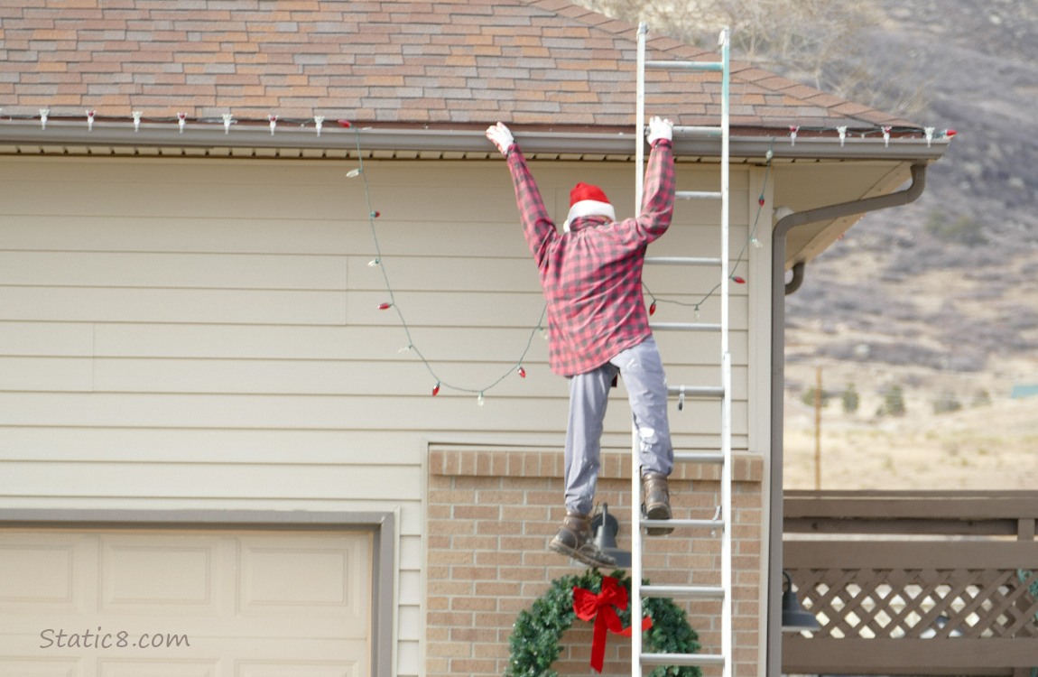 Dummy hanging from the eaves of a house