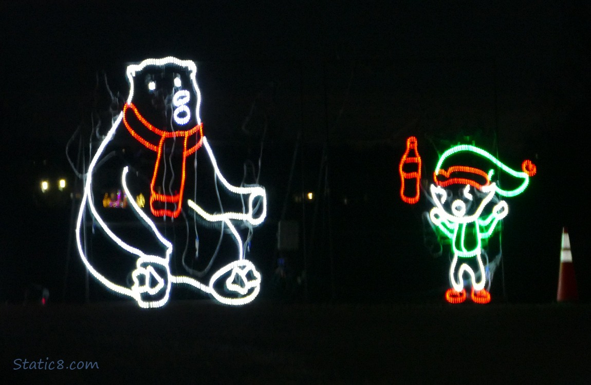 Lit Coke Polar bear and an elf throwing a coke bottle