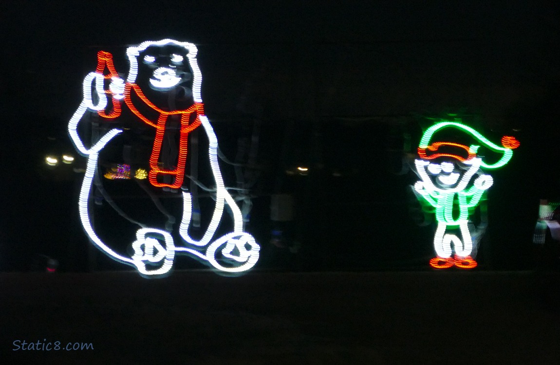 Lit Coke Polar bear and an elf throwing a coke bottle