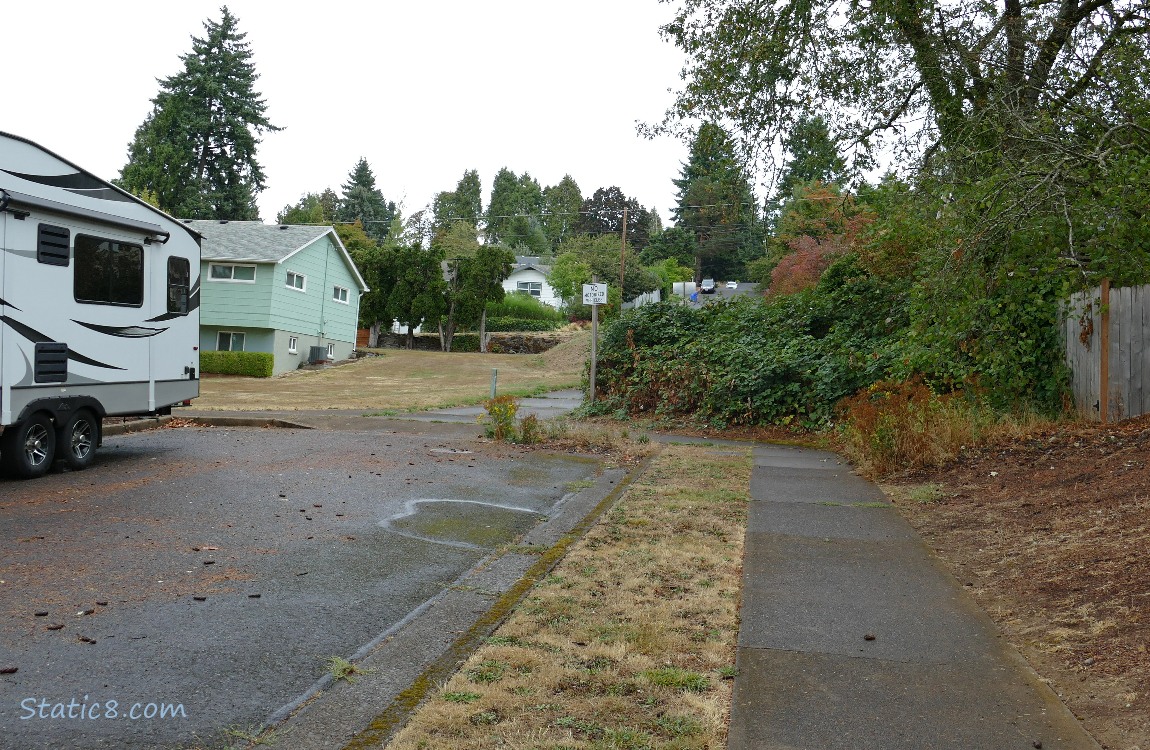 Dead end of a street with a walk thru