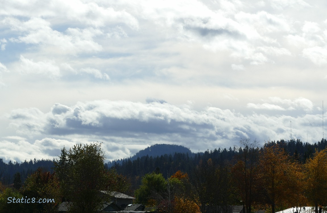 Breezy clouds over the hill