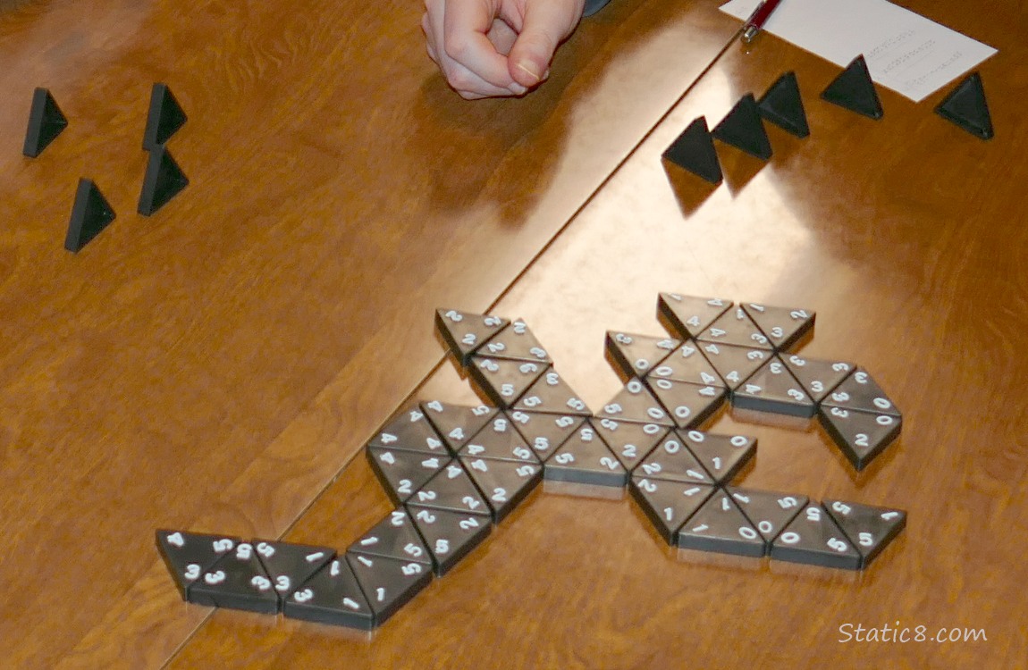 A played game of Tri-Ominos on a table