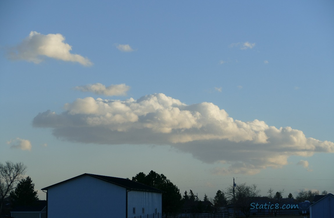 Puffy clouds in a blue sky