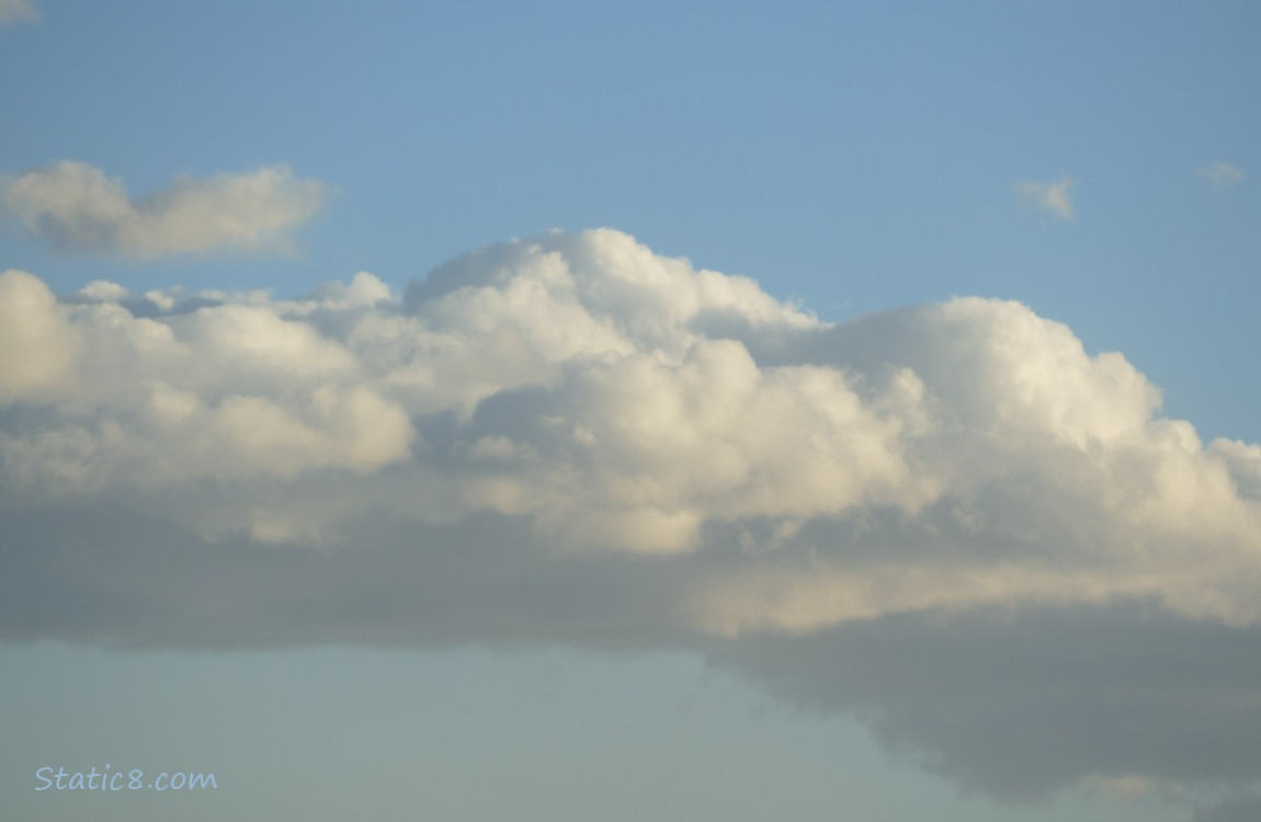 Puffy clouds in a blue sky