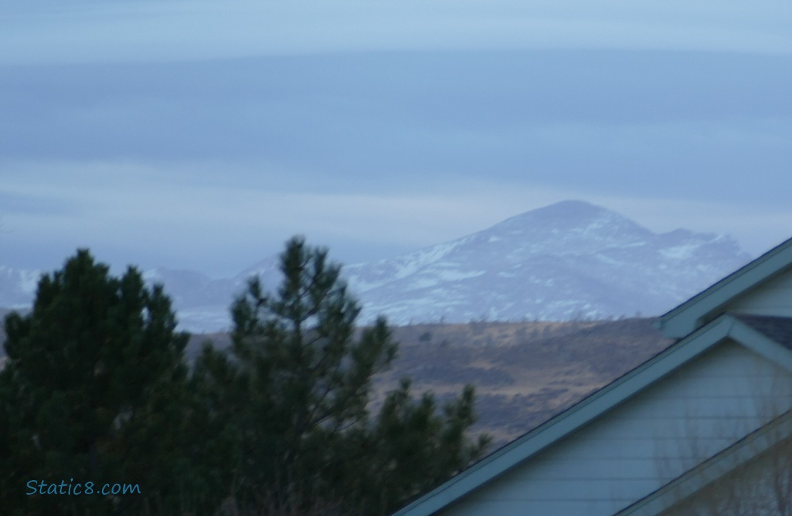 Mountain top, past the roof of a house