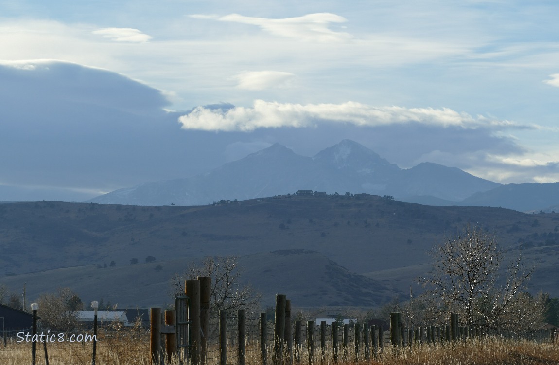 Rocky Moutains under clouds in the distance