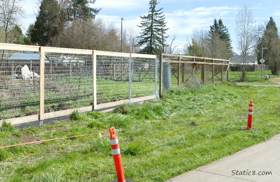Wood and wire fence next to the path