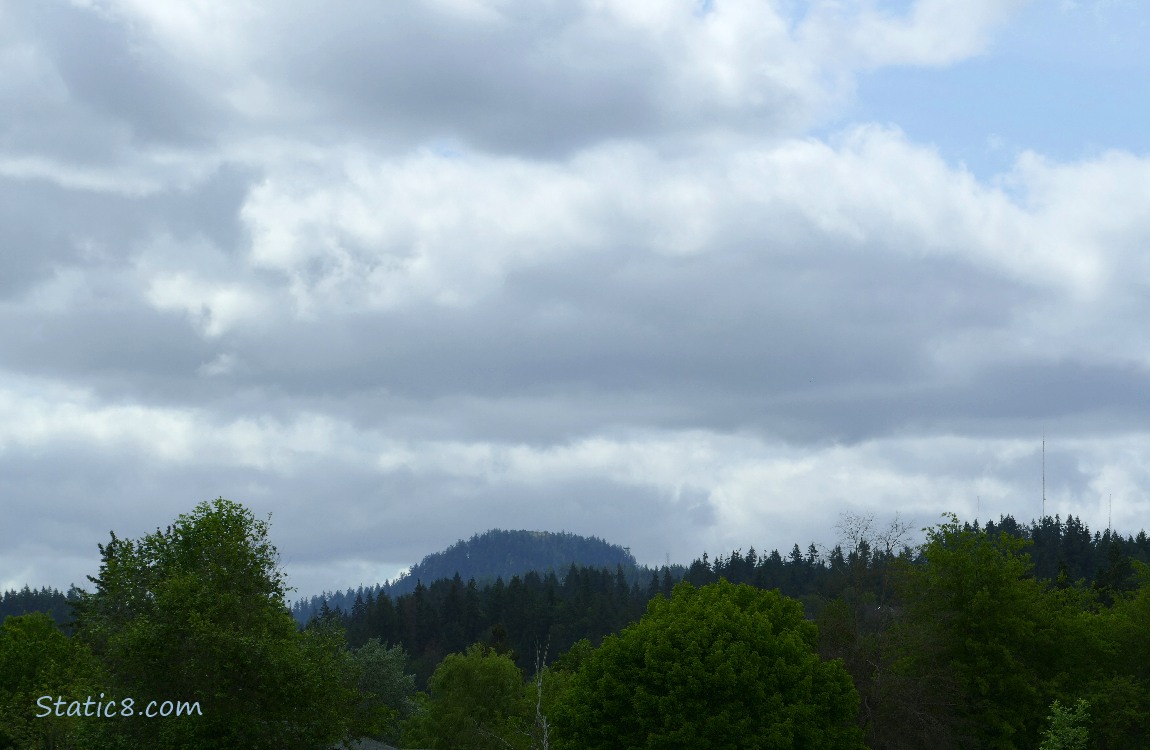 Clouds over the hill in the distance
