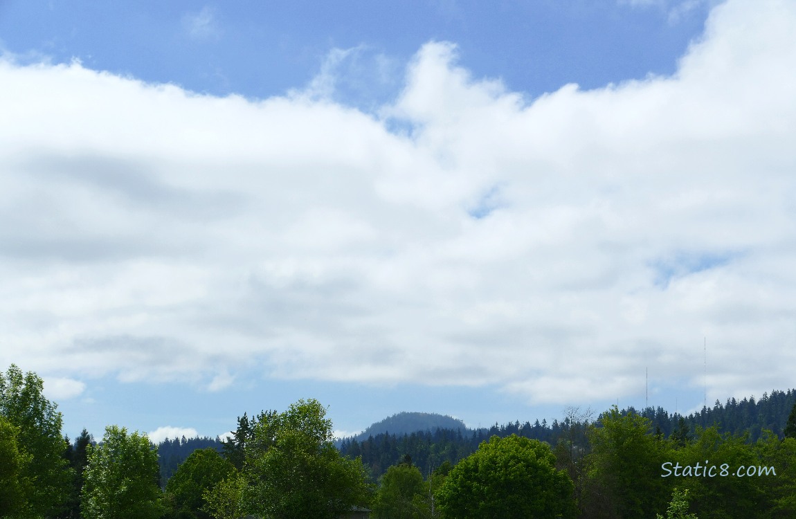 Clouds over the hill in the distance